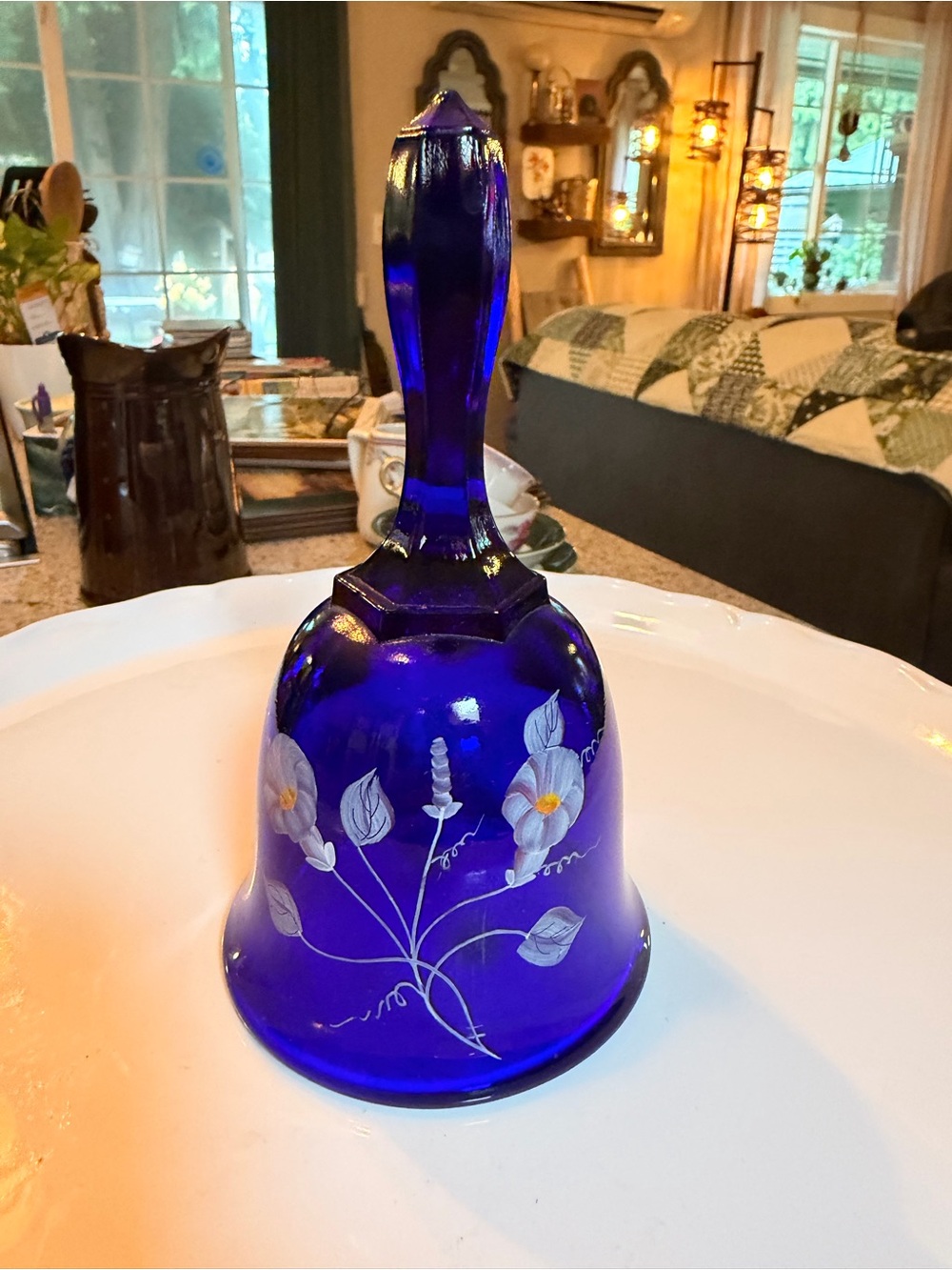 Vintage Fenton cobalt blue glass bell with hand-painted floral
decoration.